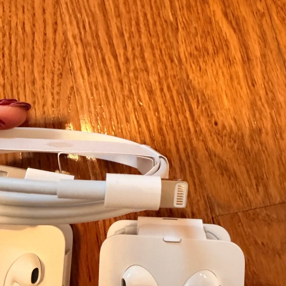 White Wired Earphones and Charging Cable